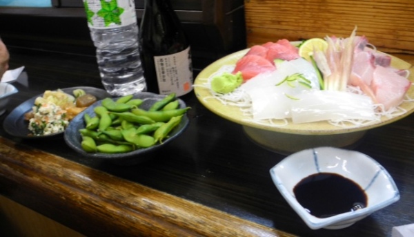 Yellow tail, tuna and squid sashimi with edamame and tofu salad